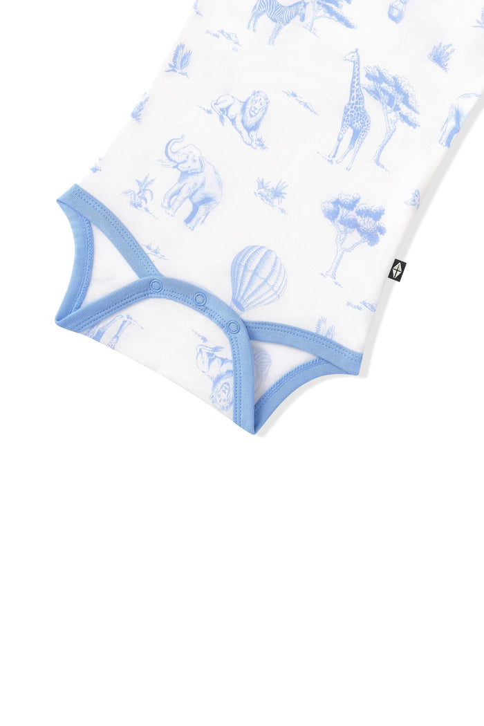 Close up of the snap closures and blue trim on the Bodysuit in Toile Safari
