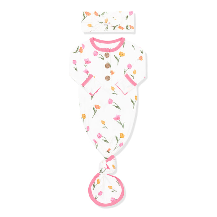 Knotted Gown with Bow Set in Tulip shown with the arms folded inwards on a white surface