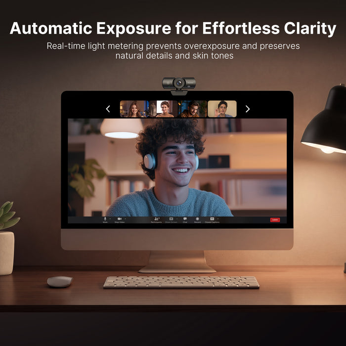 A man having a video conference in a low-light environment.