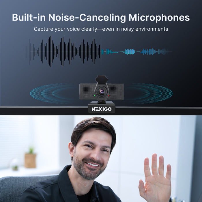 A man video chatting using a webcam with dual noise-canceling microphones.
