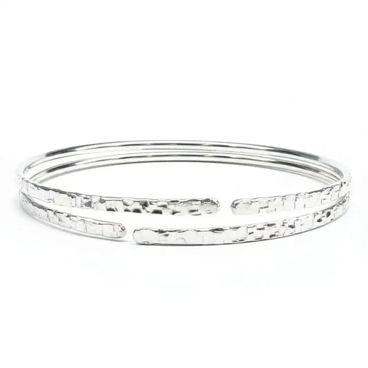 10 Gauge 925 Silver Hammer Textured Bangle showcasing a sleek design with a hammered finish for a stylish look.