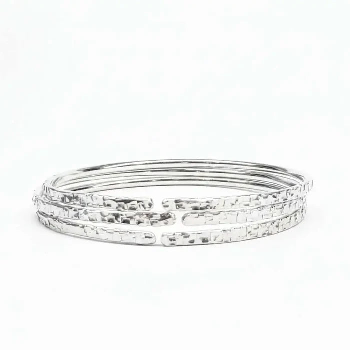 10 Gauge 925 Silver Hammer Textured Bangle showcasing a shimmering, intricate design with a hammered finish.