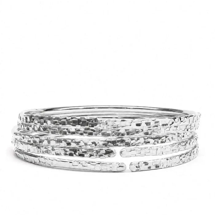 10 Gauge 925 Silver Hammer Textured Bangle showcasing a hammered design, perfect for layering and everyday wear.