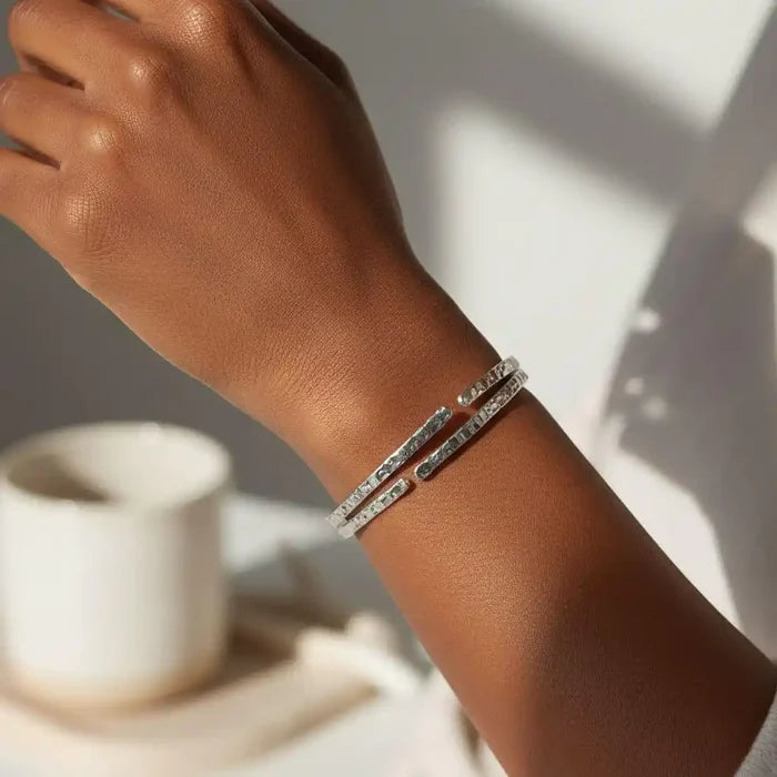 10 Gauge 925 Silver Hammer Textured Bangle worn on a wrist, showcasing its shine and elegant texture.