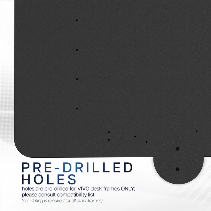Black table top with pre-drilled holes for VIVO desk frames on a white background