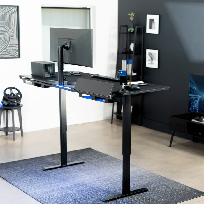 Modern office setup with a standing desk, computer monitor, and office chair.