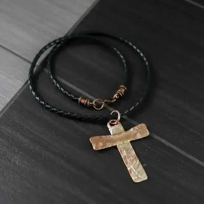 925 Silver Copper Hammer Forged Masculine Cross Necklace on a black leather cord, showcasing unique craftsmanship.