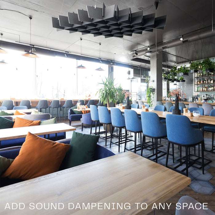 A black acoustic dual-layer ceiling waffle panel with a geometric pattern, mounted on a ceiling in a lounge/restaurant setting.