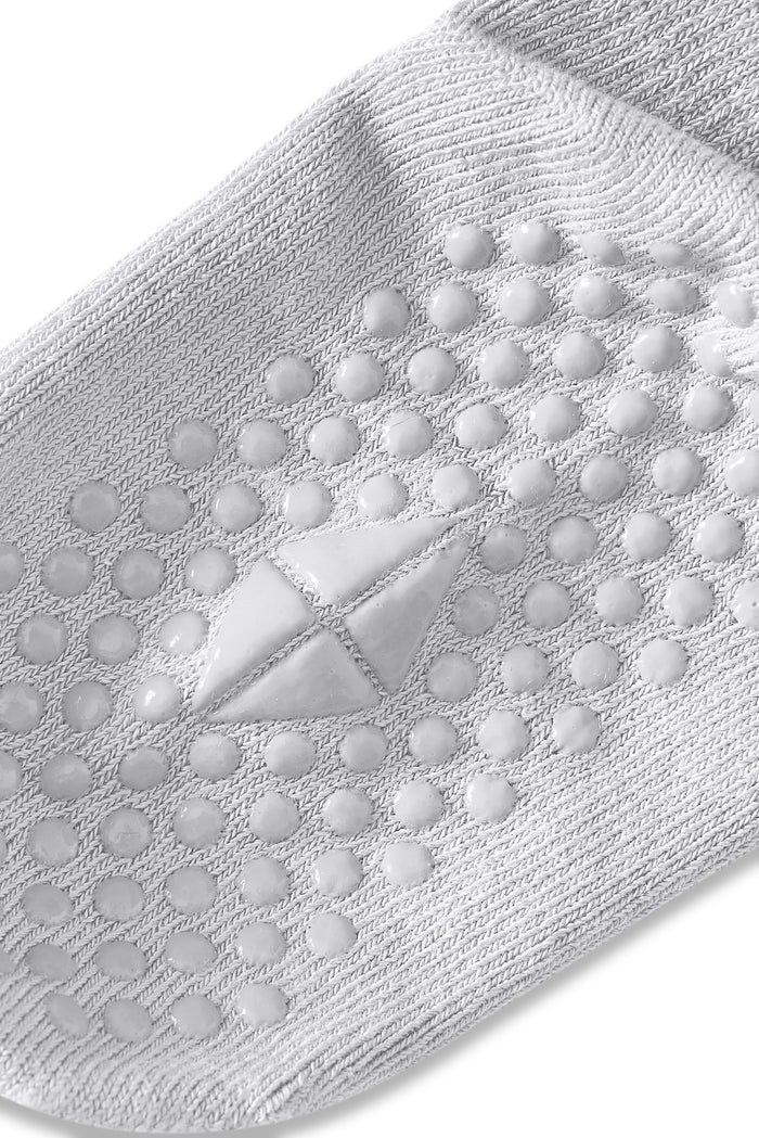 Bottom of a Kyte sock with grips.