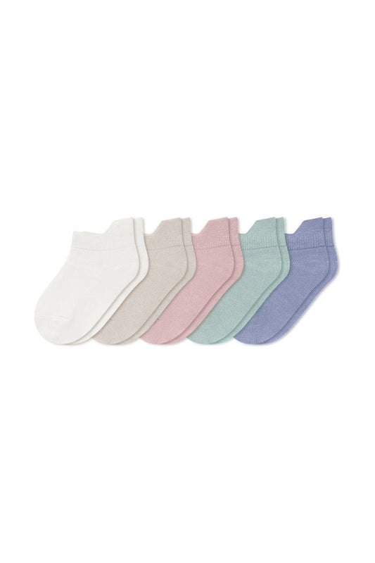 Five pairs of ankle socks in Cloud, Oat, Blush, Sage, and Haze laying flat on a white background.