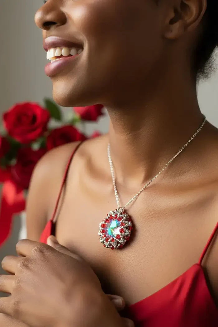 Beaded Super Sparkly Swarovski Rosette Star Pendant Necklace worn by a smiling model with roses in the background.