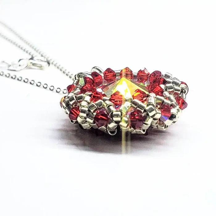 Beaded Super Sparkly Swarovski Rosette Star Pendant Necklace with red crystals, showcasing artisan craftsmanship and brilliance.