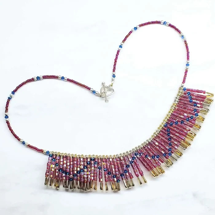 Handmade beaded Swarovski crystal zig zag bib choker necklace featuring colorful beads and golden brass safety pins.