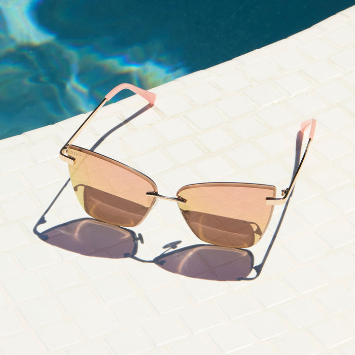 lifestyle - diff eyewear becky v gold with peach lenses sunglasses laying by the pool