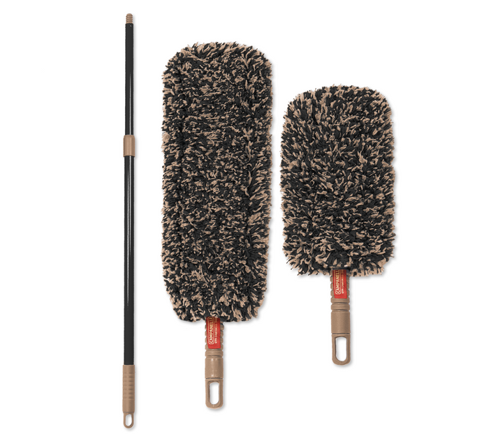 Two dusters on a plain white background: one long-handled duster with a black pole and beige handle, and one short-handled duster with a black and beige shaggy head and beige handle. Both are shown upright against a clean white studio background.
