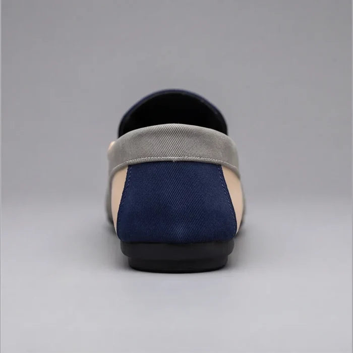 Pair of casual canvas loafers shown from the side
