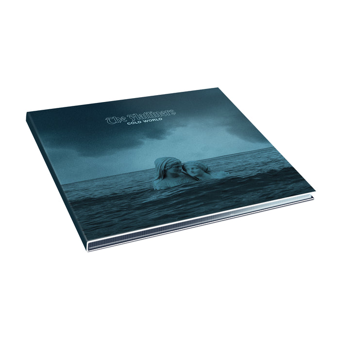 A square music album cover titled Old World by The Flatliners shows two people partly submerged in a dark blue ocean beneath a cloudy sky. The album lies flat, displaying its front cover before the official release.