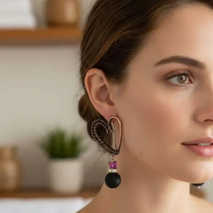 Model wearing Copper Sculpted Heart Hoop Crystal Lava Rock Earrings showcasing elegant design and unique craftsmanship.
