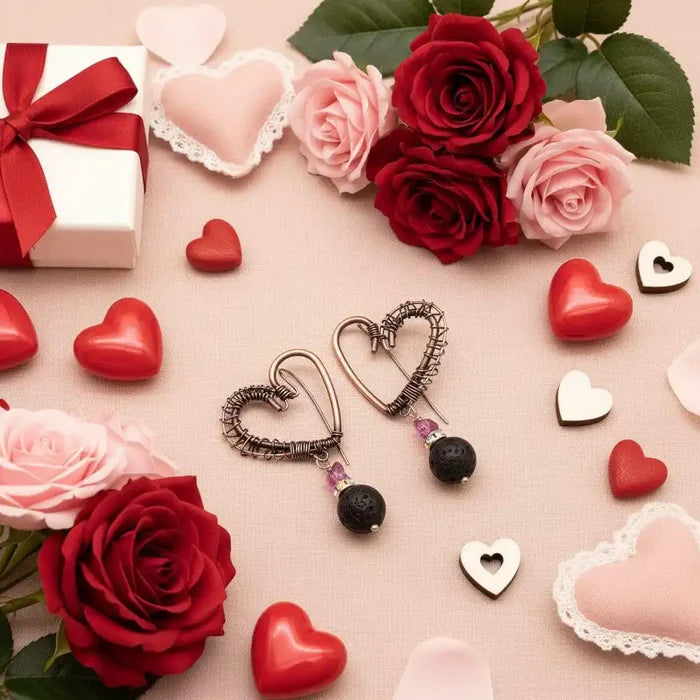 Copper Sculpted Heart Hoop Crystal Lava Rock Earrings surrounded by red and pink roses and decorative hearts.
