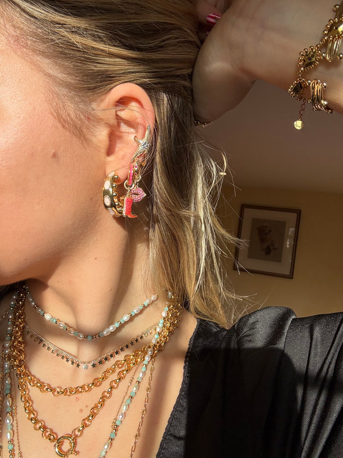 Summer jewellery stack with chunky gold statement pieces