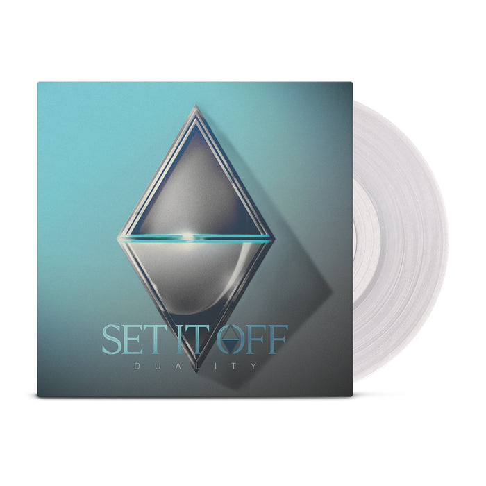 A Clear Vinyl LP by Set It Off partially slides out of its cover, which showcases a metallic diamond on a blue background. The bottom features the album title "DUALITY," emphasizing its bold duality theme.