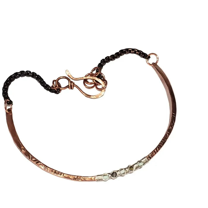 Ergonomic Copper Sculpted Embossed Wire Gemstone Choker featuring a unique design with gemstones and a secure clasp.