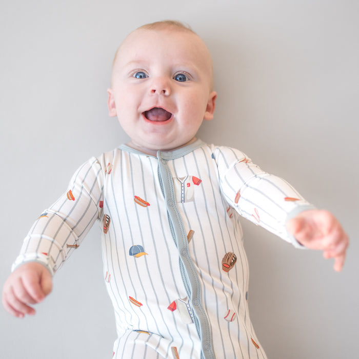 Close up of infant wearing the Footie in Home Run