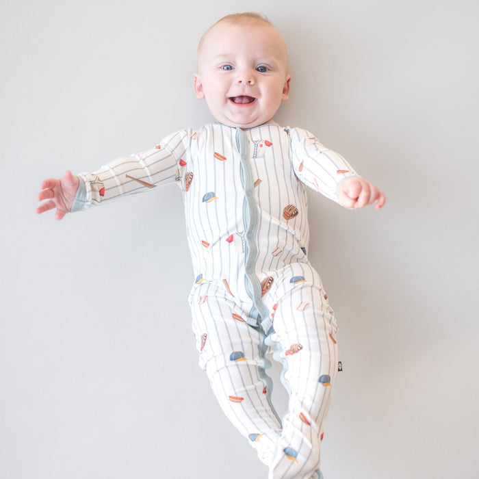 Smiling infant waering the Footie in Home Run