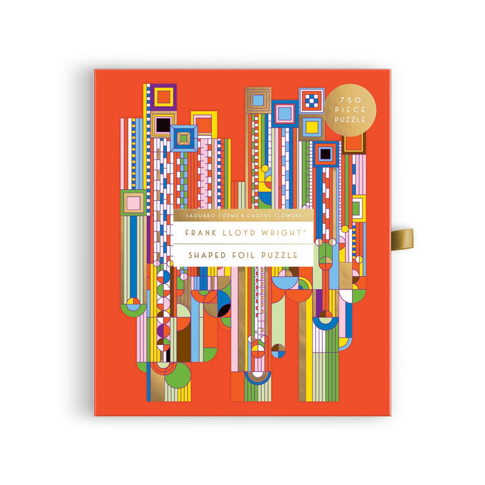 The Frank Lloyd Wright Foundation’s Saguaro Forms & Cactus Flowers 750 Piece Shaped Foil Puzzle features vibrant geometric rectangles, circles, and lines on a bright orange background, inspired by his iconic design.