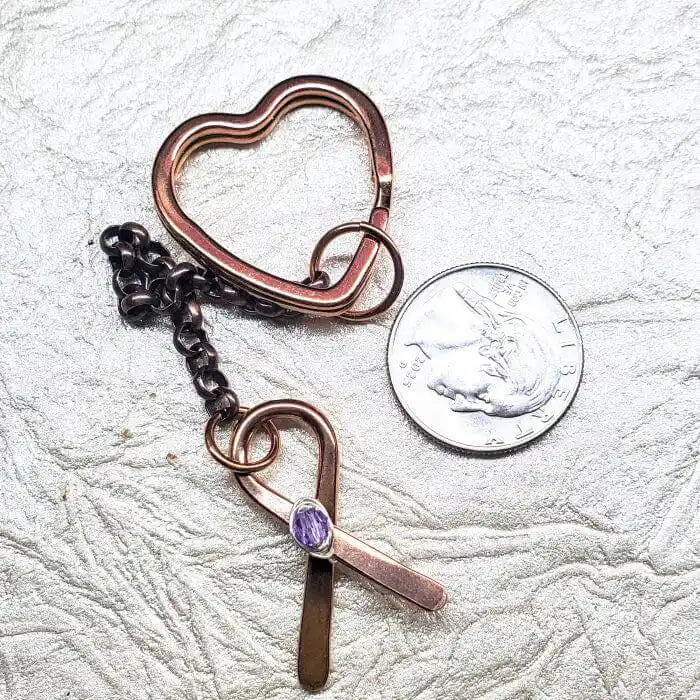 Handmade Caregiver Crystal Copper Ribbon Heart Key Chain with copper ribbon charm next to a quarter for size reference
