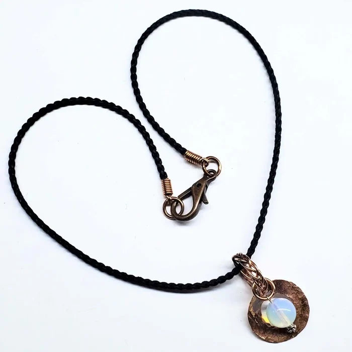 Handmade copper wire braided bail gemstone necklace featuring a rare Luminite gemstone pendant.