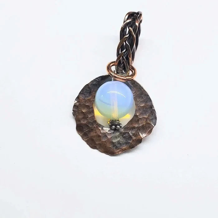 Handmade copper wire braided bail gemstone necklace featuring a rare Luminite gemstone pendant.