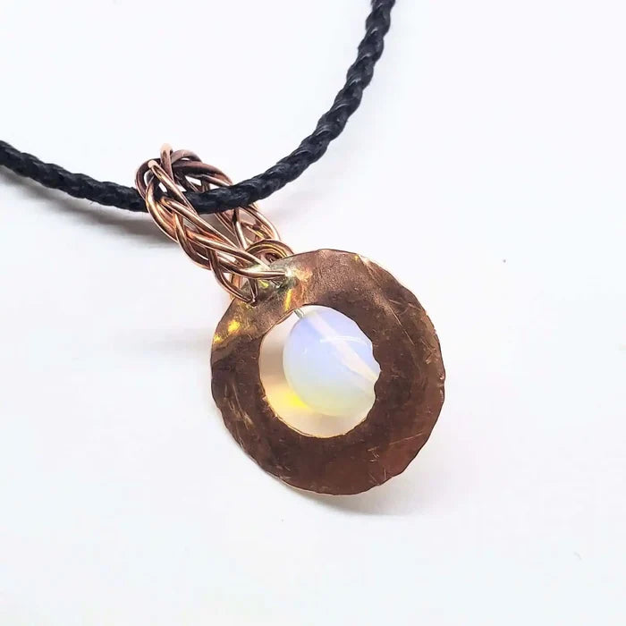 Handmade copper wire braided bail gemstone necklace featuring a rare Luminite gemstone in a unique design.