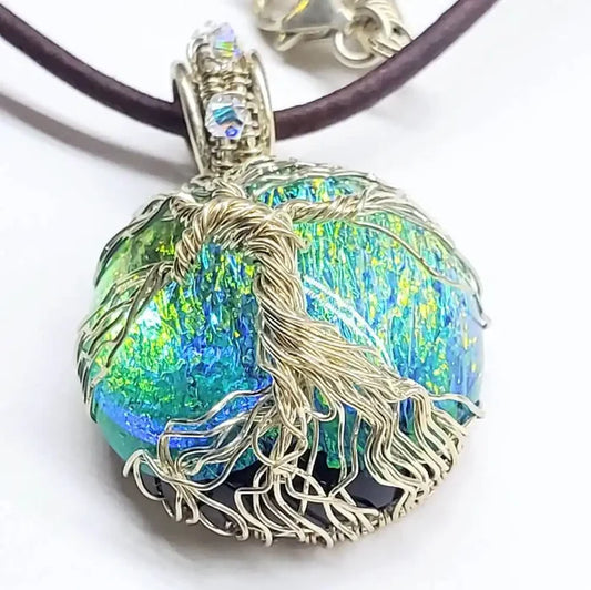 Handmade Tree of Life Dichroic Pendant Necklace featuring colorful dichroic glass and intricate wire wrapping.