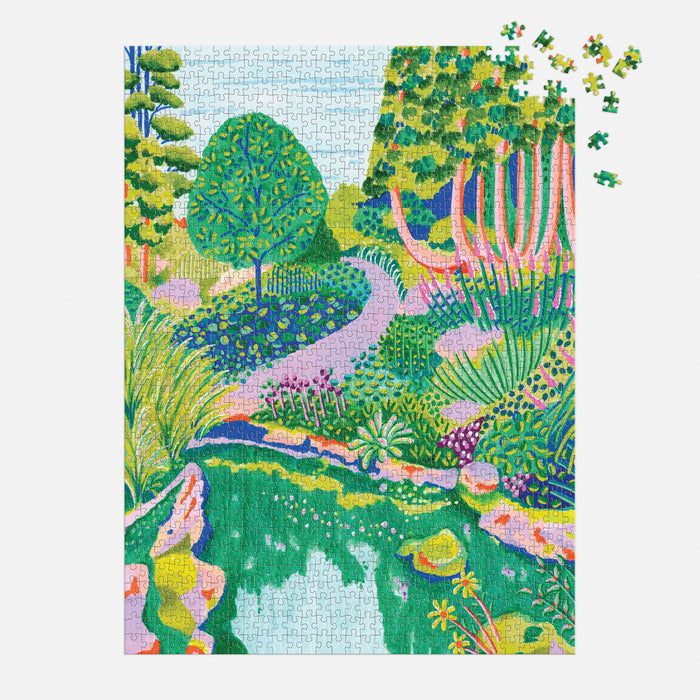 The High Grove 1000 Piece Puzzle in Square Box by Alice Brisland features a vibrant garden scene with trees, plants, and a pond. A few pieces are missing in the top right corner, making it perfect for High Grove puzzle enthusiasts.