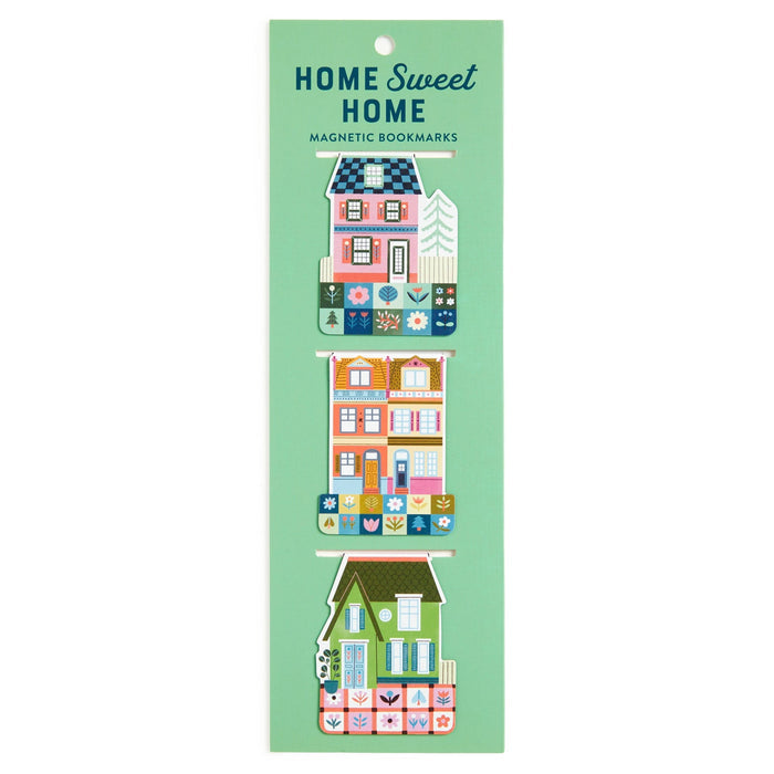The Home Sweet Home Magnetic Bookmarks by Molly Egan features three illustrated, house-shaped bookmarks in green packaging, each adorned with colorful details and floral patterns.