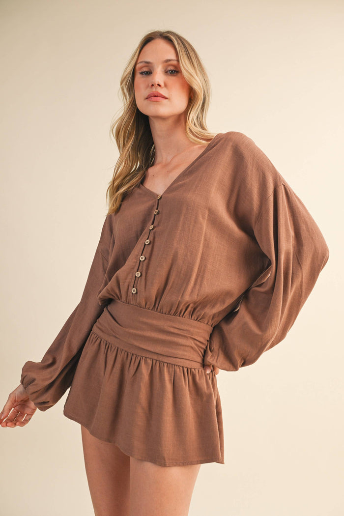 IR2396 LINEN LONGSLEEVE BUTTON AND SMOCKED WAIST ROMPER: Black / M