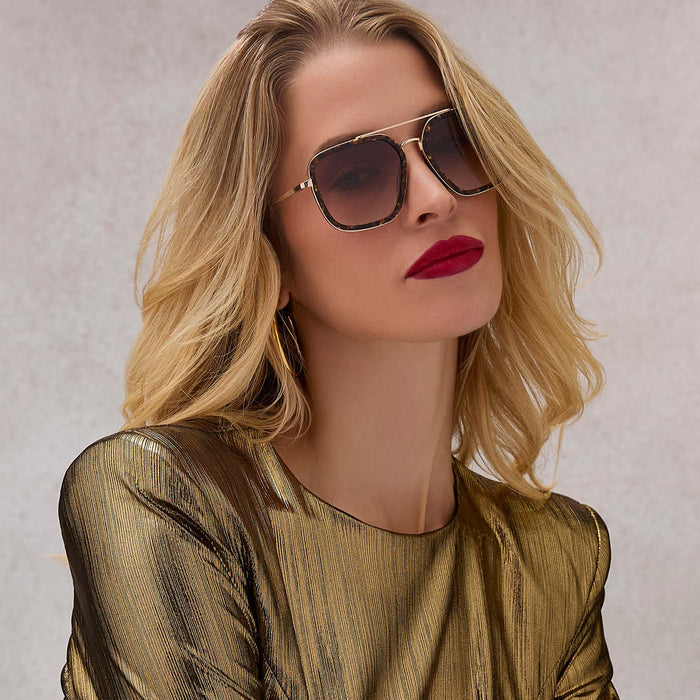 on model - female wearing diff eyewear featuring the jordan navigator sunglasses with a glitter tortoise frame and brown gradient lenses front view