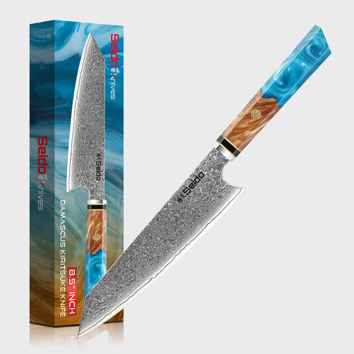 Sakao Damascus kitchen knife with wooden handle and branded packaging on a white background