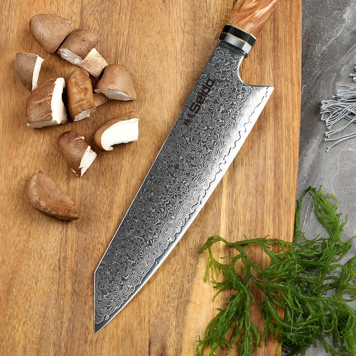 Damascus knife on a wooden cutting board with mushrooms and seaweed