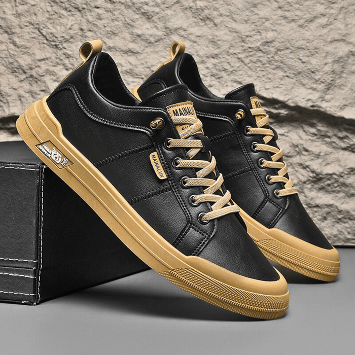 Close-up view of smooth leather low-top sneaker construction