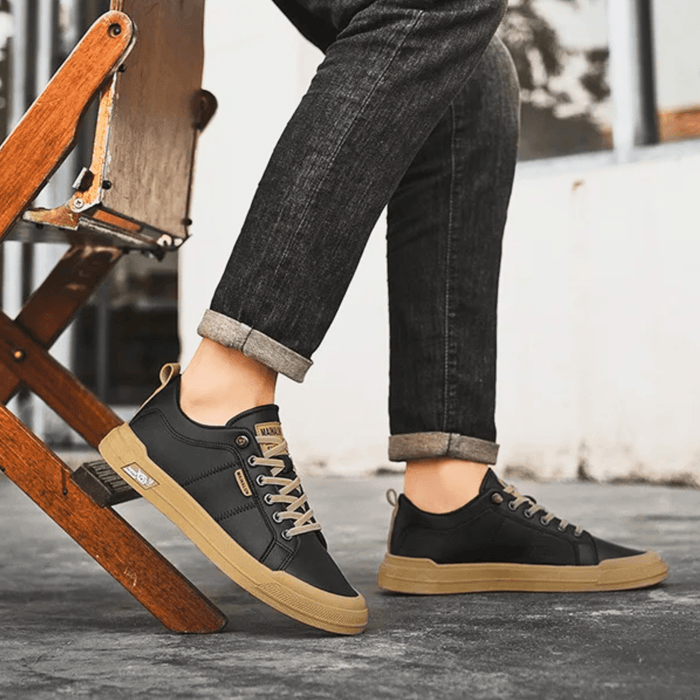 Pair of leather low-top sneakers with streamlined silhouettes
