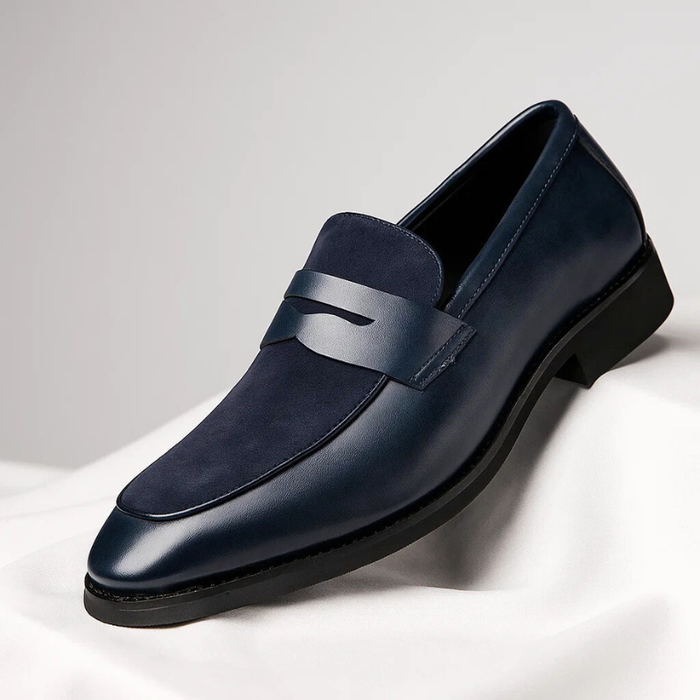 Leather penny loafers with a suede panel shown from the side