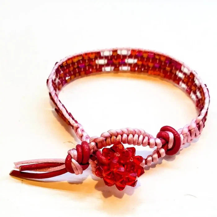 Leather Silk Bead Woven Crystal Button Bracelet featuring pink silk, red leather, and Swarovski crystals.