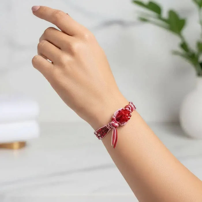 Leather Silk Bead Woven Crystal Button Bracelet displayed on a hand, showcasing its vibrant colors and intricate design.