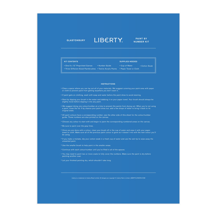 A blue instruction sheet for the Liberty London Liberty 9 x 12 Paint by Number Kit Glastonbury features centered white text with step-by-step instructions, kit contents, and needed supplies, including premium acrylic paints.