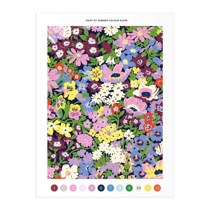 The Liberty London 9 x 12 Paint by Number Kit Thorpe is inspired by the Liberty archive, featuring colorful flowers in purple, pink, yellow, blue, and white with numbered color swatches (1–12) for easy reference.