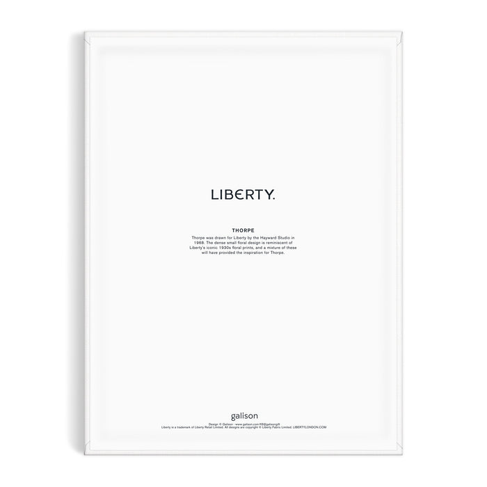 Minimalist art print inspired by the Liberty textile archive, featuring LIBERTY. in bold above a Thoreau quote on white. Framed in white, with Liberty London and “Liberty 9 x 12 Paint by Number Kit Thorpe” noted at the bottom.