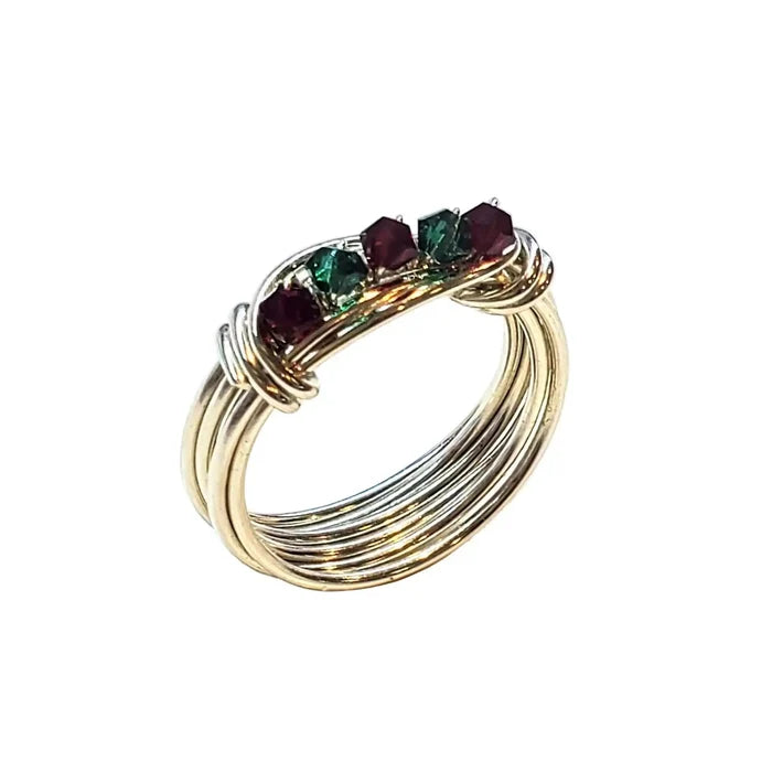 Limited edition 2026 silver wire wrapped Christmas ring featuring Swarovski crystals in red and green.
