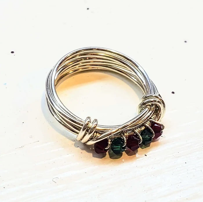 Limited edition 2026 silver wire wrapped Christmas ring featuring Swarovski crystals in red and green.